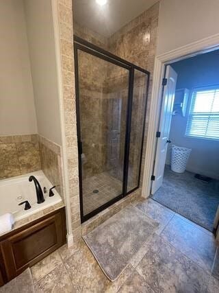 10211 Lydia Ln, Danville, AR 72833 - bathroom with a tub and a stall shower
