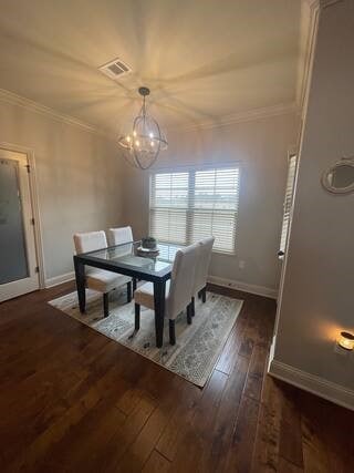 10211 Lydia Ln, Danville, AR 72833 - dining space featuring hardwood / wood-style floors, crown molding, baseboards, and a chandelier