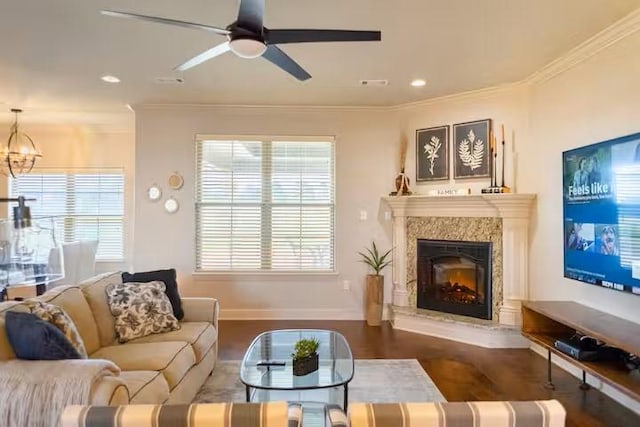 10211 Lydia Ln, Danville, AR 72833 - living area featuring ceiling fan, dark wood-style floors, a chandelier, ornamental molding, and a high end fireplace