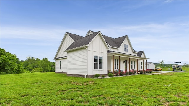 14290 Osage Creek Rd, Springdale, AR 72762 - view of home's exterior featuring board and batten siding, covered porch, a yard, and a shingled roof
