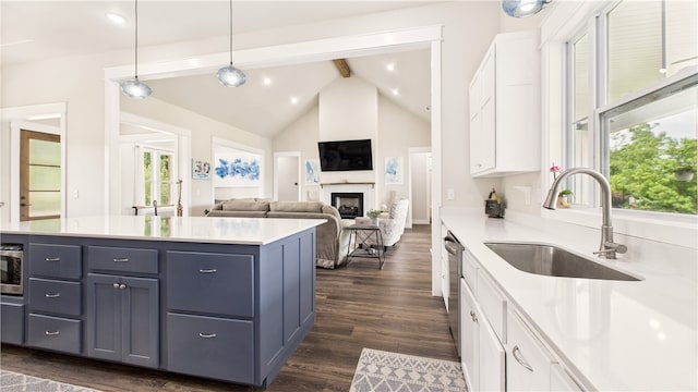 14290 Osage Creek Rd, Springdale, AR 72762 - kitchen with a sink, white cabinetry, beam ceiling, stainless steel dishwasher, and light countertops