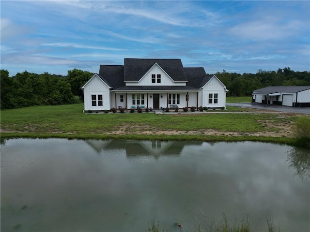 14290 Osage Creek Rd, Springdale, AR 72762 - view of front of home featuring a detached garage, a water view, and board and batten siding
