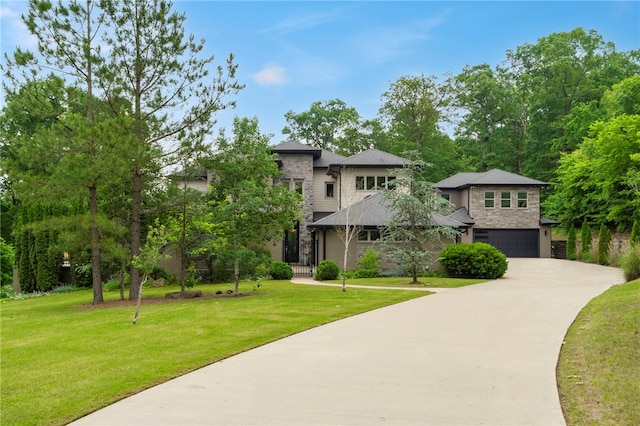 3634 Sugarberry Ln, Springdale, AR 72764 - view of front of house featuring stone siding, a garage, a front lawn, and driveway