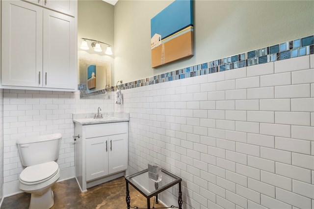 3634 Sugarberry Ln, Springdale, AR 72764 - half bathroom with tile walls, vanity, toilet, and a wainscoted wall