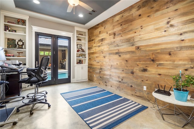3634 Sugarberry Ln, Springdale, AR 72764 - home office with concrete flooring, built in shelves, wood walls, a ceiling fan, and recessed lighting