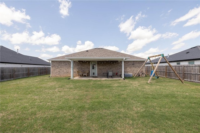 6013 Quinn St, Fayetteville, AR 72704 - rear view of property with a patio area, a playground, and brick siding