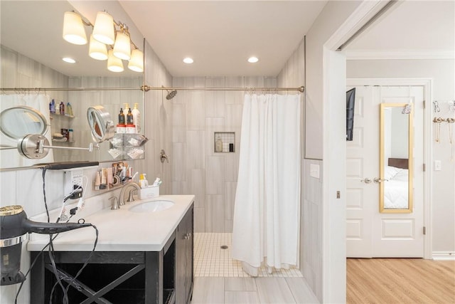 6013 Quinn St, Fayetteville, AR 72704 - full bathroom with a tile shower, vanity, ornamental molding, and recessed lighting