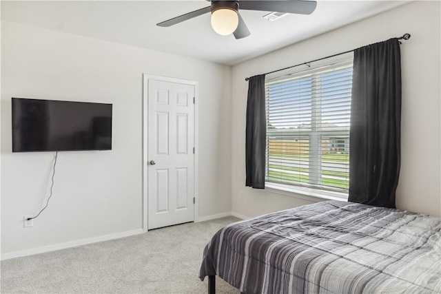 2409 S Silver St, Siloam Springs, AR 72761 - carpeted bedroom featuring baseboards and ceiling fan