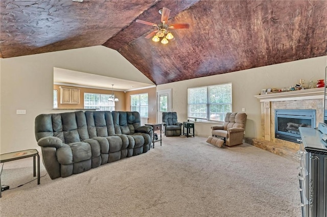 22 Dunstable Dr, Bella Vista, AR 72714 - carpeted living room with lofted ceiling, ceiling fan, and a tile fireplace