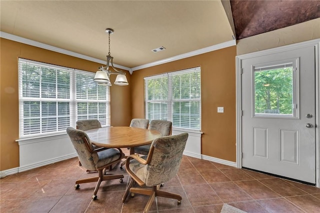 22 Dunstable Dr, Bella Vista, AR 72714 - dining space featuring ornamental molding, dark tile patterned floors, and baseboards