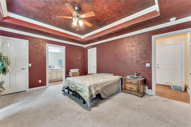 22 Dunstable Dr, Bella Vista, AR 72714 - carpeted bedroom featuring a raised ceiling, crown molding, connected bathroom, baseboards, and ceiling fan