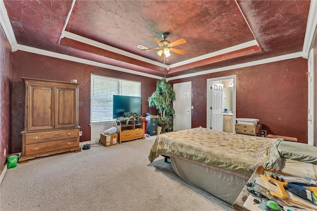 22 Dunstable Dr, Bella Vista, AR 72714 - bedroom with a tray ceiling, ornamental molding, carpet, baseboards, and ensuite bathroom