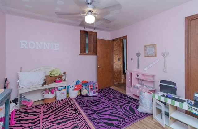 817 Madison 8610, Huntsville, AR 72740 - bedroom with wood finished floors and a ceiling fan
