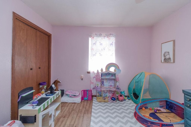 817 Madison 8610, Huntsville, AR 72740 - playroom featuring wood finished floors
