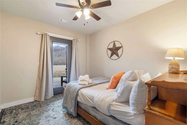 4933 Rocky Ridge Trl, Little Flock, AR 72756 - bedroom featuring baseboards, access to exterior, and ceiling fan