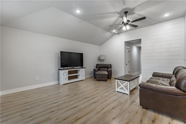 8 Grantham Dr, Bella Vista, AR 72714 - living area with a ceiling fan, vaulted ceiling, light wood-type flooring, baseboards, and wooden walls