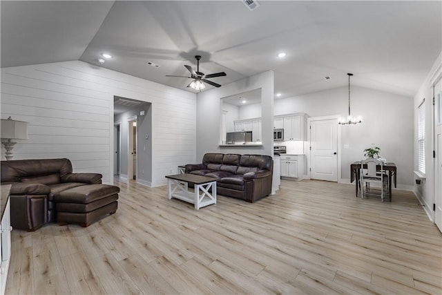 8 Grantham Dr, Bella Vista, AR 72714 - living room featuring lofted ceiling, ceiling fan, light wood-style floors, recessed lighting, and wood walls