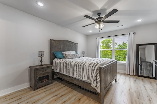 8 Grantham Dr, Bella Vista, AR 72714 - bedroom featuring light wood finished floors, baseboards, recessed lighting, and a ceiling fan