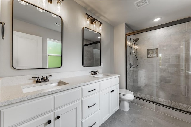 8 Grantham Dr, Bella Vista, AR 72714 - bathroom with toilet, tiled shower, double vanity, and tile patterned floors