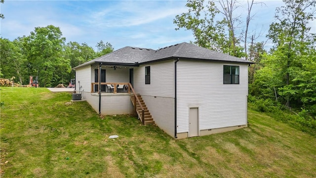 8 Grantham Dr, Bella Vista, AR 72714 - back of property with stairway, a yard, crawl space, roof with shingles, and central AC unit