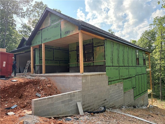 34 Chatburn Ln, Bella Vista, AR 72715 - view of side of property featuring board and batten siding