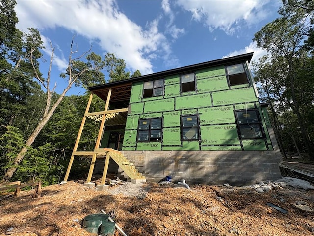 34 Chatburn Ln, Bella Vista, AR 72715 - view of side of home featuring stairway