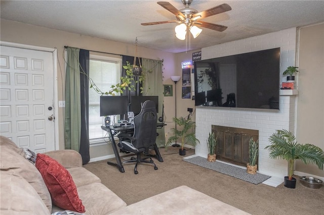 1627 W Hefley St, Fayetteville, AR 72703 - office area featuring ceiling fan, carpet, a brick fireplace, and baseboards