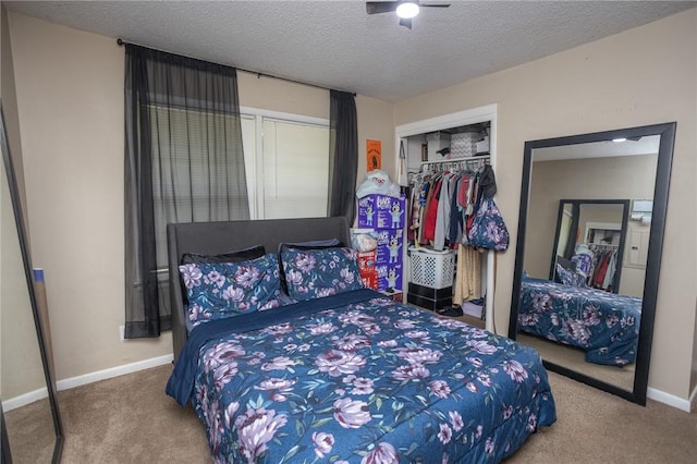 1627 W Hefley St, Fayetteville, AR 72703 - carpeted bedroom featuring a closet, baseboards, and a textured ceiling