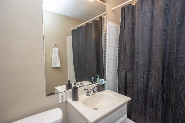 1627 W Hefley St, Fayetteville, AR 72703 - bathroom with toilet, vanity, and a shower with curtain