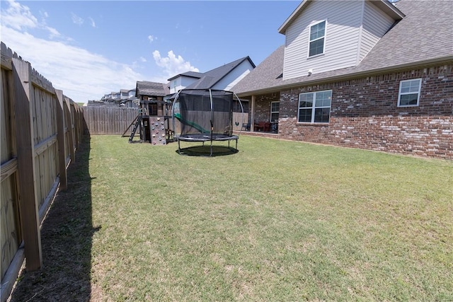 5803 SW Gentle Winds Ave, Bentonville, AR 72713 - view of yard featuring a trampoline and a playground