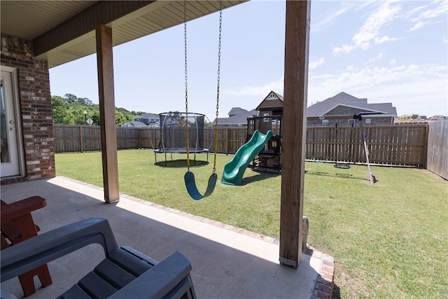 5803 SW Gentle Winds Ave, Bentonville, AR 72713 - view of patio / terrace featuring a playground and a trampoline