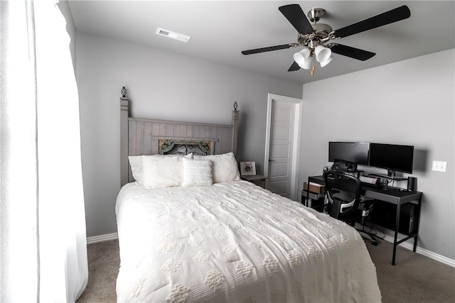 5803 SW Gentle Winds Ave, Bentonville, AR 72713 - carpeted bedroom with baseboards, ceiling fan, and a desk