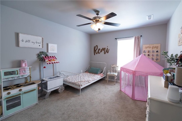 5803 SW Gentle Winds Ave, Bentonville, AR 72713 - carpeted bedroom with a ceiling fan