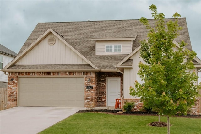 5803 SW Gentle Winds Ave, Bentonville, AR 72713 - view of front facade featuring board and batten siding, driveway, brick siding, roof with shingles, and a front lawn