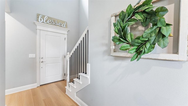 5803 SW Gentle Winds Ave, Bentonville, AR 72713 - entrance foyer with wood finished floors, stairway, and baseboards