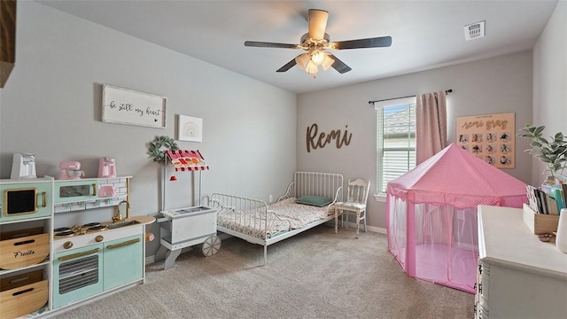 5803 SW Gentle Winds Ave, Bentonville, AR 72713 - carpeted bedroom with a ceiling fan and baseboards