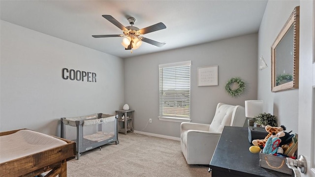 5803 SW Gentle Winds Ave, Bentonville, AR 72713 - bedroom with light carpet, baseboards, and ceiling fan