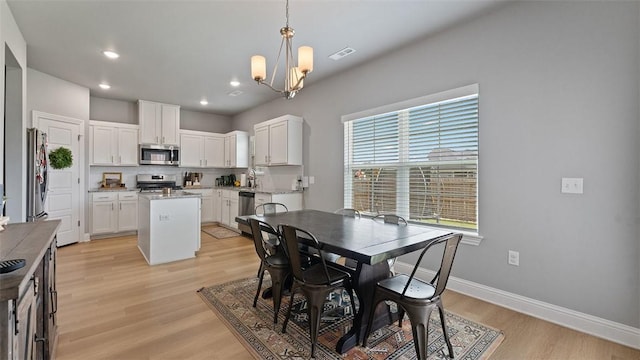 5803 SW Gentle Winds Ave, Bentonville, AR 72713 - dining room with a chandelier, light wood-type flooring, baseboards, and recessed lighting