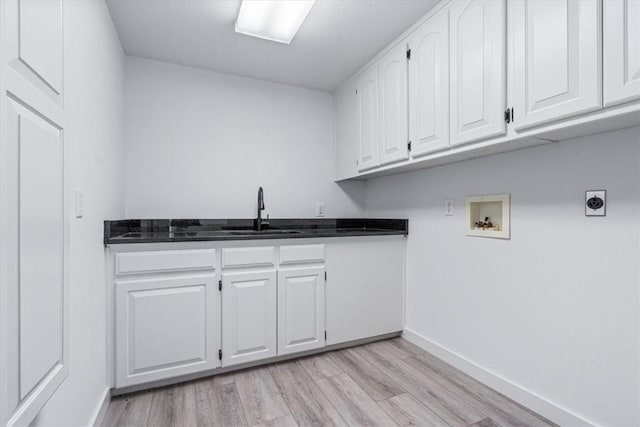 119 Elm St, Centerton, AR 72719 - laundry area with washer hookup, cabinet space, light wood-style floors, and electric dryer hookup