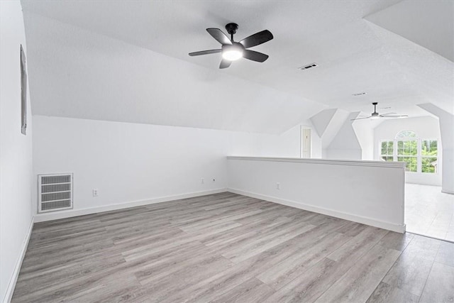 119 Elm St, Centerton, AR 72719 - additional living space featuring a ceiling fan, wood finished floors, vaulted ceiling, and baseboards