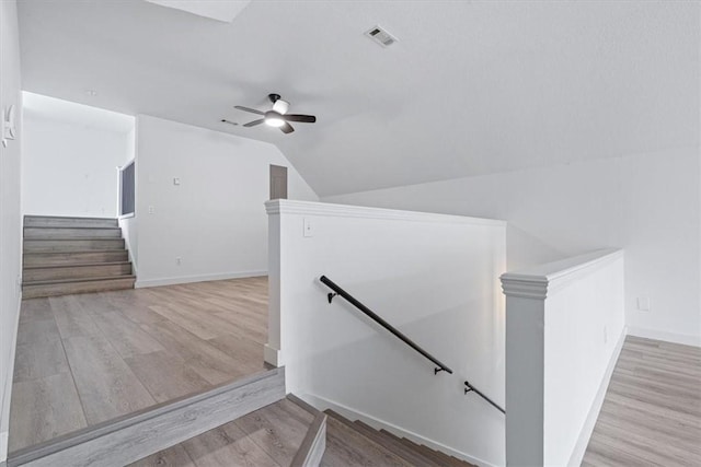 119 Elm St, Centerton, AR 72719 - staircase featuring wood finished floors, lofted ceiling, ceiling fan, and baseboards