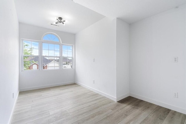 119 Elm St, Centerton, AR 72719 - empty room with wood finished floors and baseboards