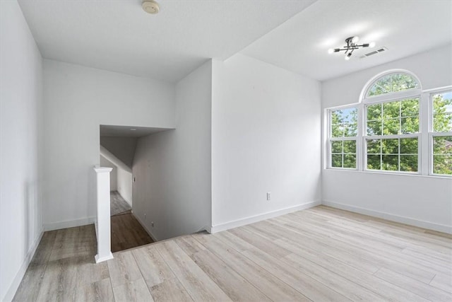 119 Elm St, Centerton, AR 72719 - spare room featuring wood finished floors, a smoke detector, and baseboards