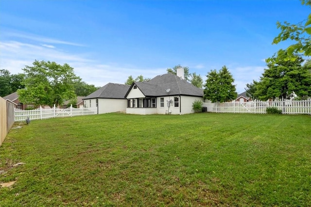 119 Elm St, Centerton, AR 72719 - rear view of house featuring a chimney and stucco siding