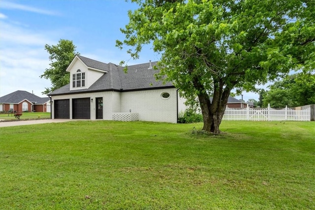 119 Elm St, Centerton, AR 72719 - view of side of property featuring driveway, a shingled roof, an attached garage, and brick siding