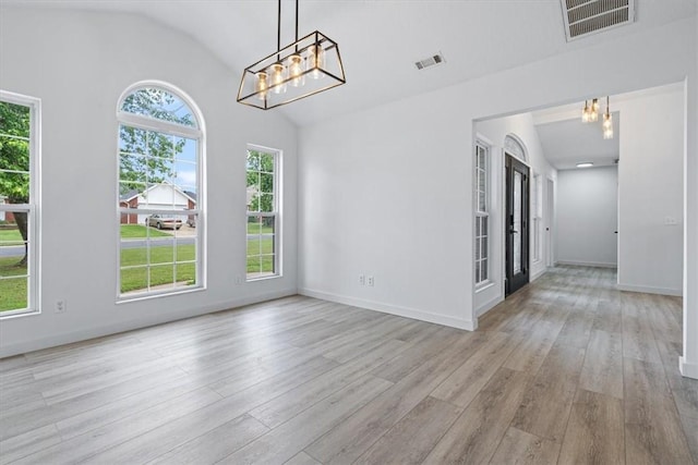 119 Elm St, Centerton, AR 72719 - unfurnished room featuring lofted ceiling, a chandelier, wood finished floors, and baseboards