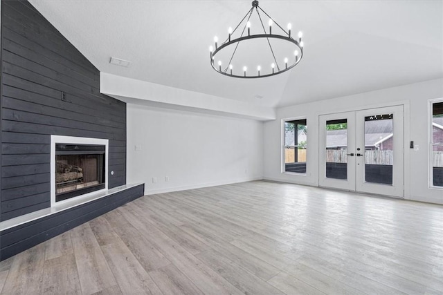 119 Elm St, Centerton, AR 72719 - unfurnished living room featuring high vaulted ceiling, a chandelier, wood finished floors, french doors, and a large fireplace