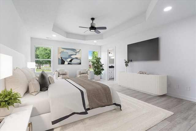 119 Elm St, Centerton, AR 72719 - bedroom with recessed lighting, wood finished floors, a raised ceiling, a ceiling fan, and ensuite bath