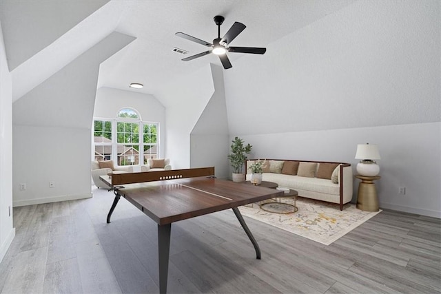 119 Elm St, Centerton, AR 72719 - living room featuring wood finished floors, vaulted ceiling, ceiling fan, and baseboards
