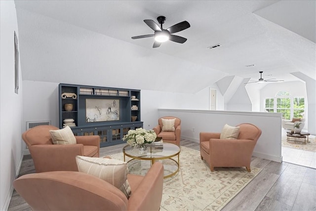 119 Elm St, Centerton, AR 72719 - sitting room featuring ceiling fan, lofted ceiling, wood finished floors, and baseboards